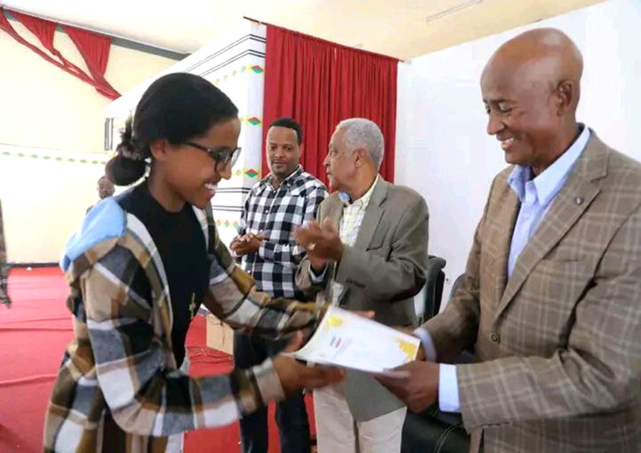 Student receiving award at ceremony