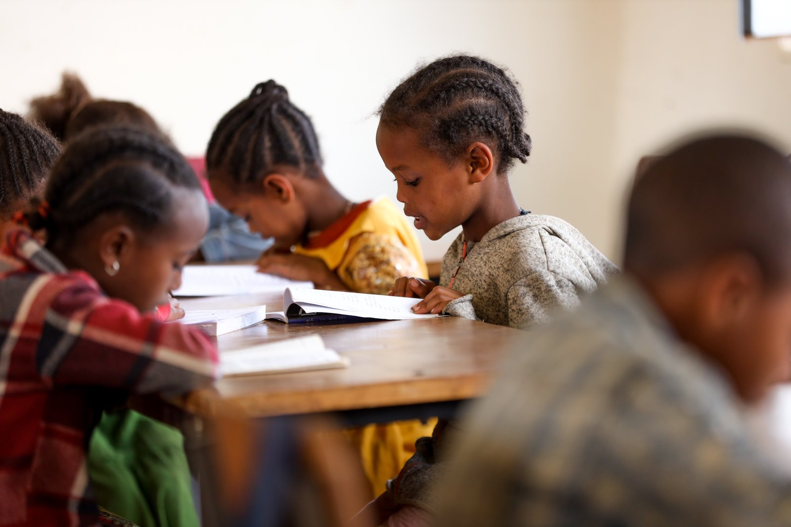 Students reading textbooks in class