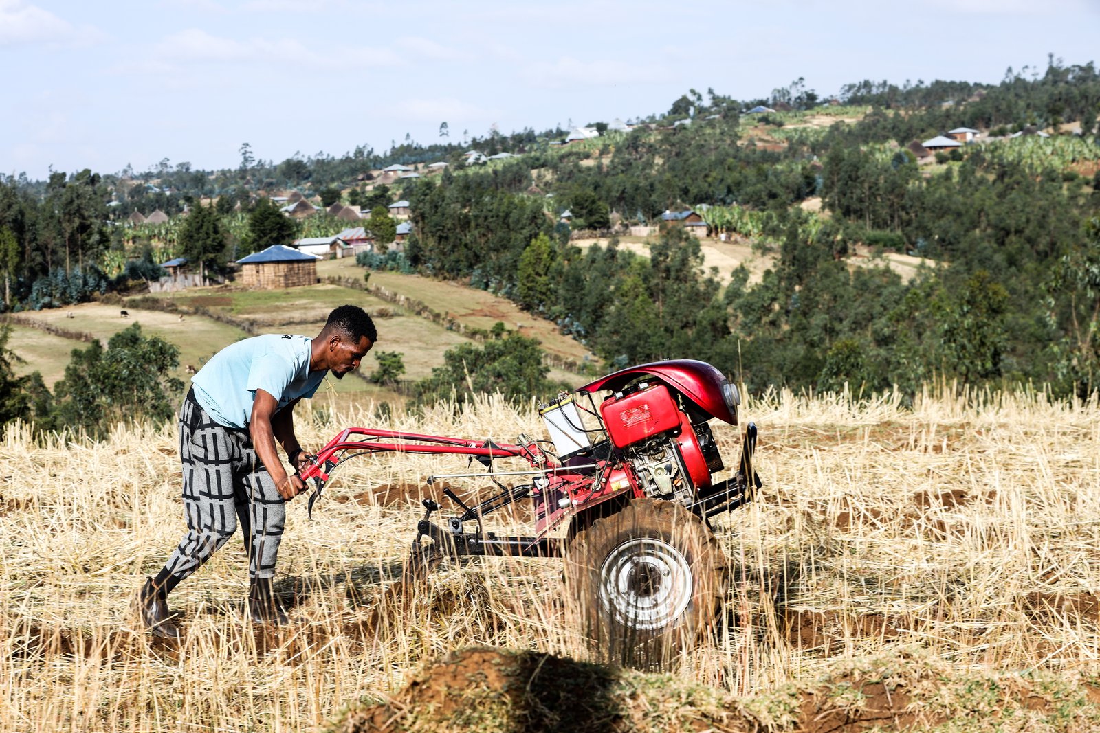 Farmer working the land with a tractor